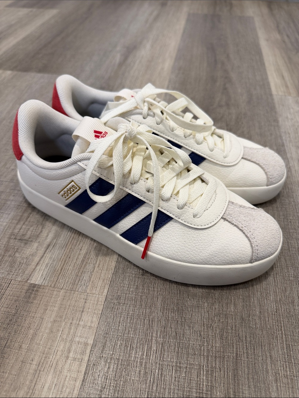 adidas White Sneakers with Navy Three Stripes and Red Heel Accent